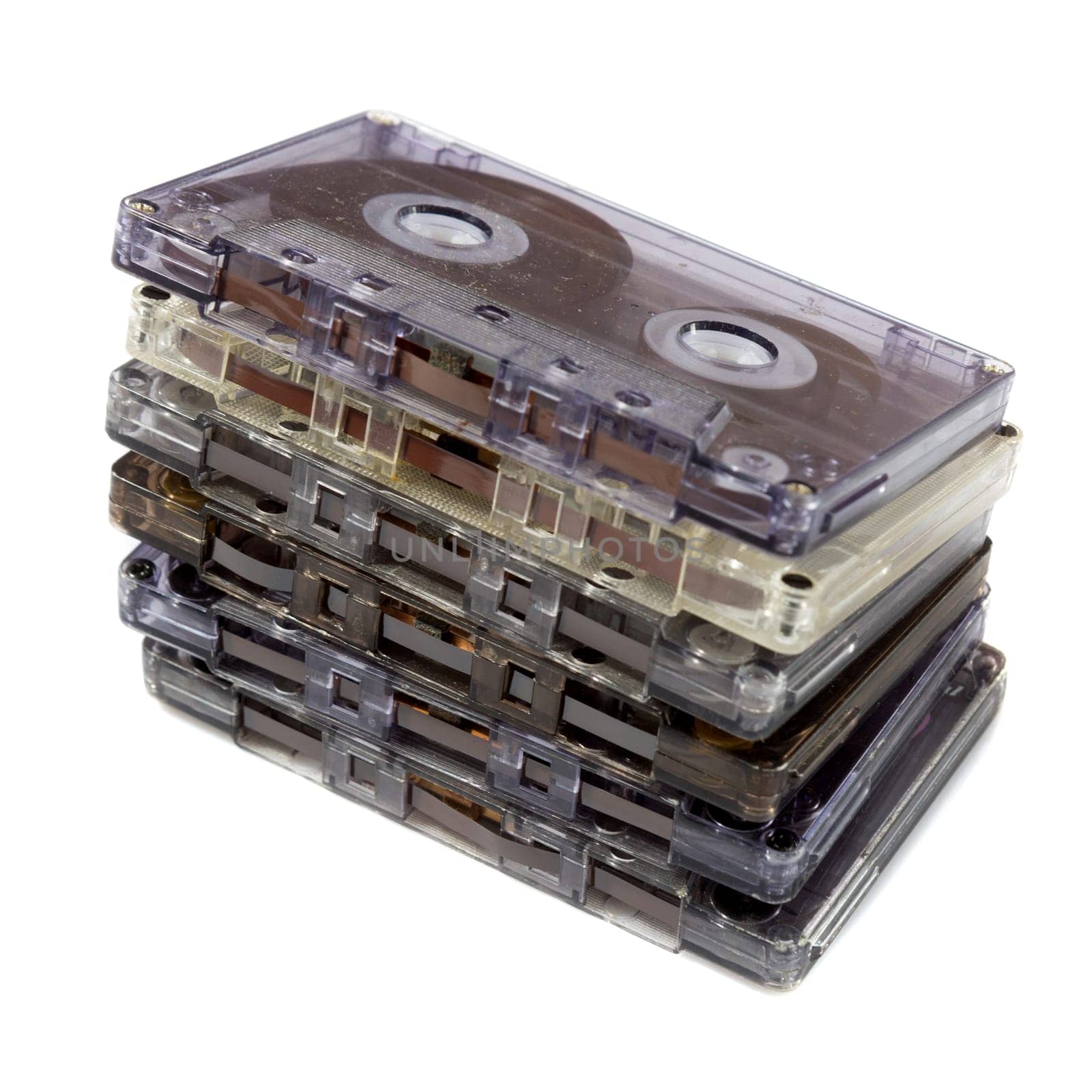 pile of audio compact cassettes on a white background