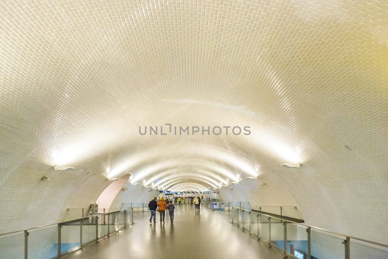 LISBON, PORTUGAL - DEC 27, 2008: people hurry in the old metro station in Lisbon to the train. The metro is one of the oldest in europe.