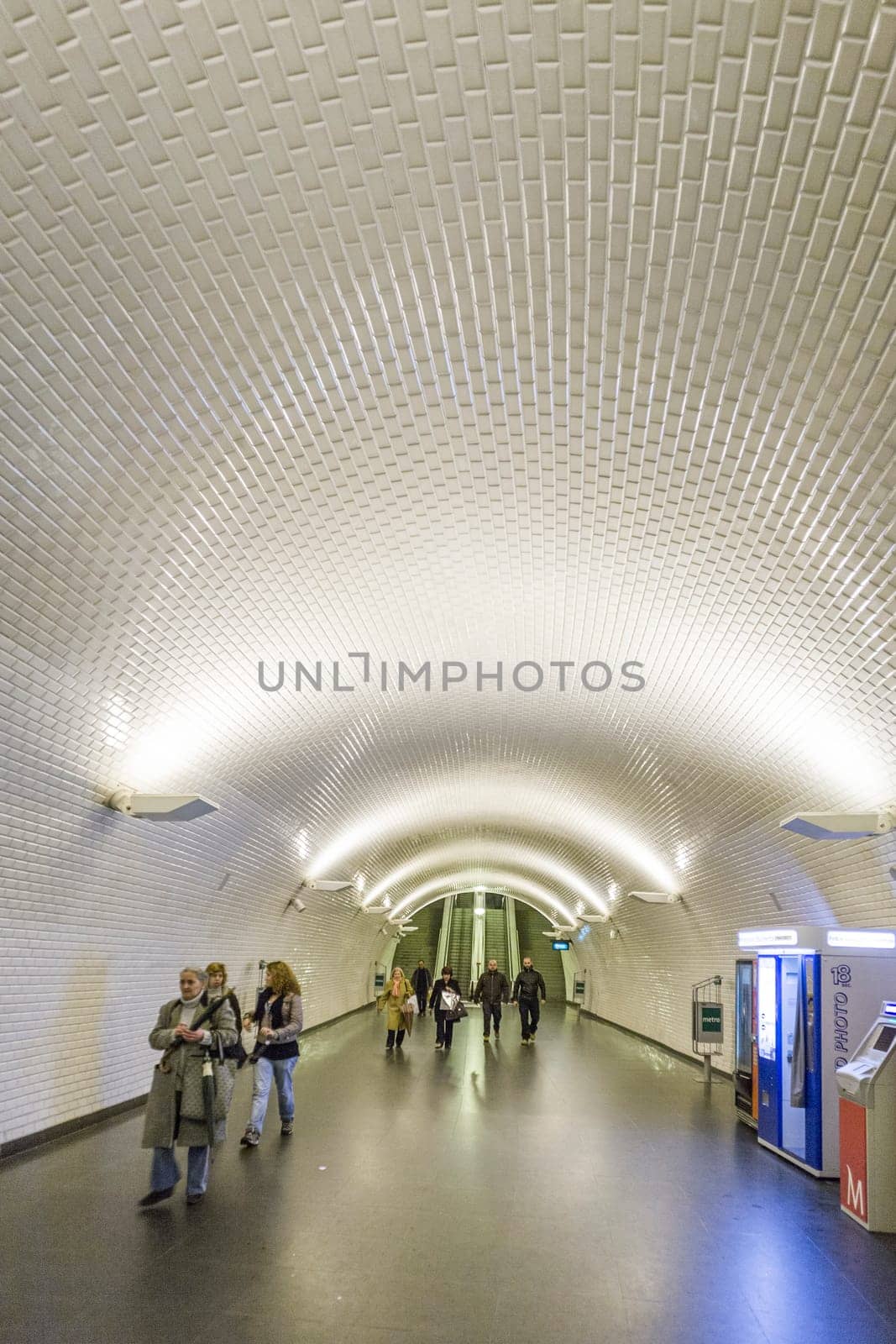 LISBON, PORTUGAL - DEC 27, 2008: people hurry in the old metro station in Lisbon to the train. The metro is one of the oldest in europe.