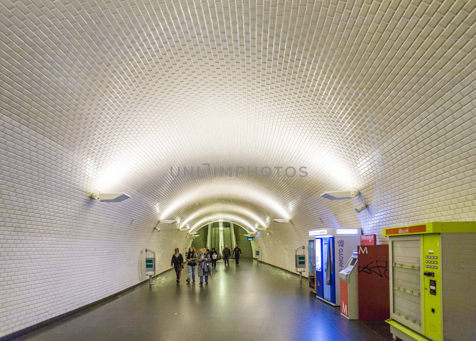 LISBON, PORTUGAL - DEC 27, 2008: people hurry in the old metro station in Lisbon to the train. The metro is one of the oldest in europe.