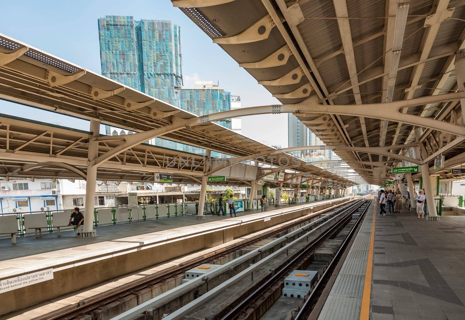 Bangkok, Thailand - December 22, 2009: people at Nana Metro Station. The skytrain soffers the quickest transportation in town.