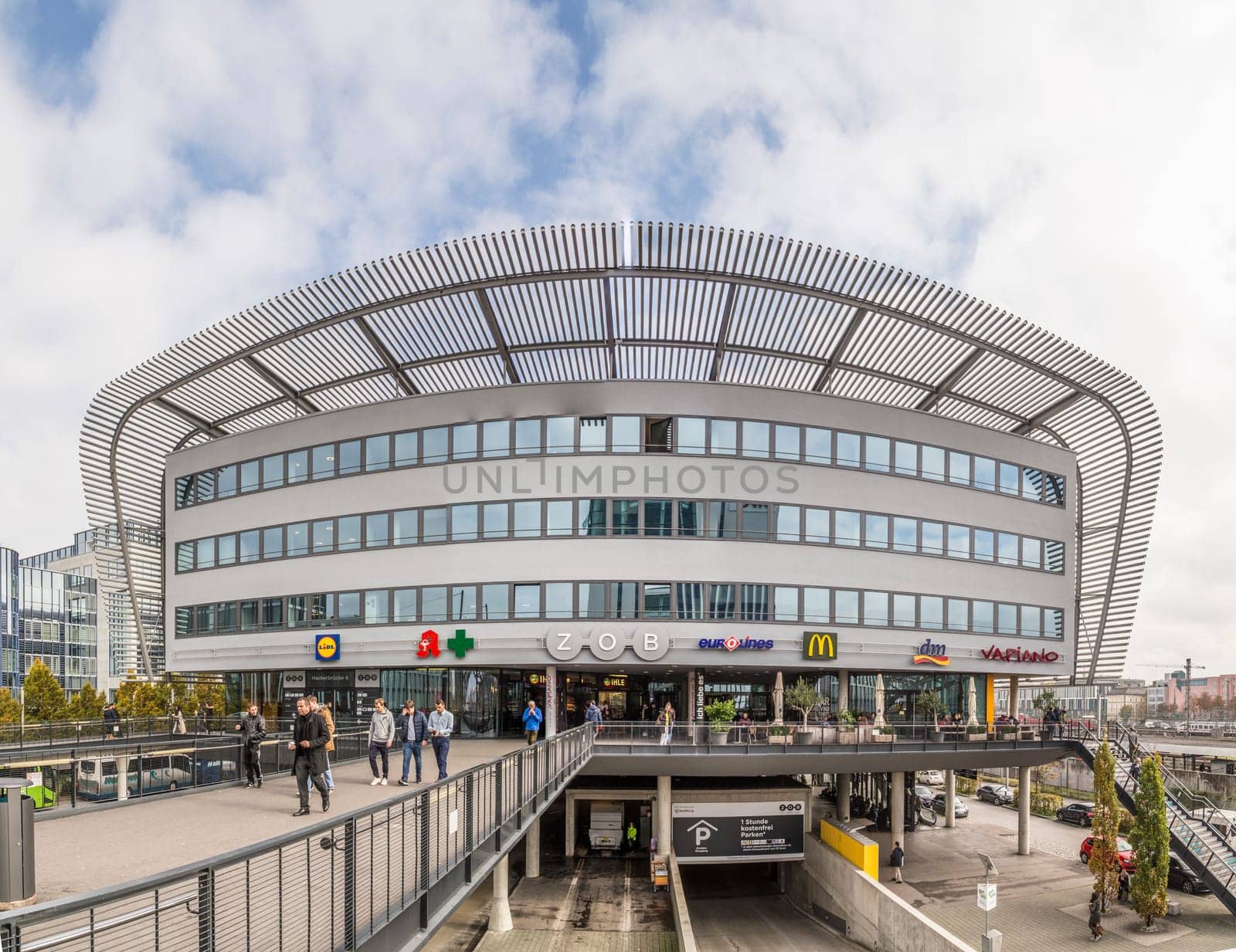 MUNICH, GERMANY - OCT 26, 2016: People at the central bus station called ZOB in Munich. The new ZOB was inaugurated in  in Munich, Bavaria, Germany in 2009.