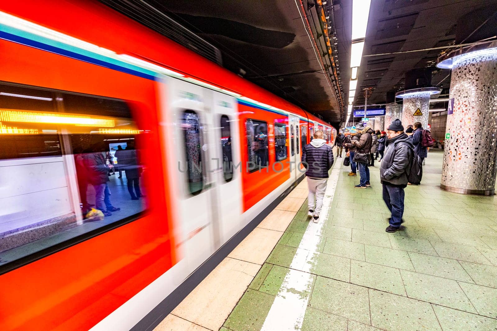 Frankfurt, Germany - February 27, 2018:  people waiting at central station Frankfurt for  the S-Bahn, the public transportation metro system in Frankfurt.