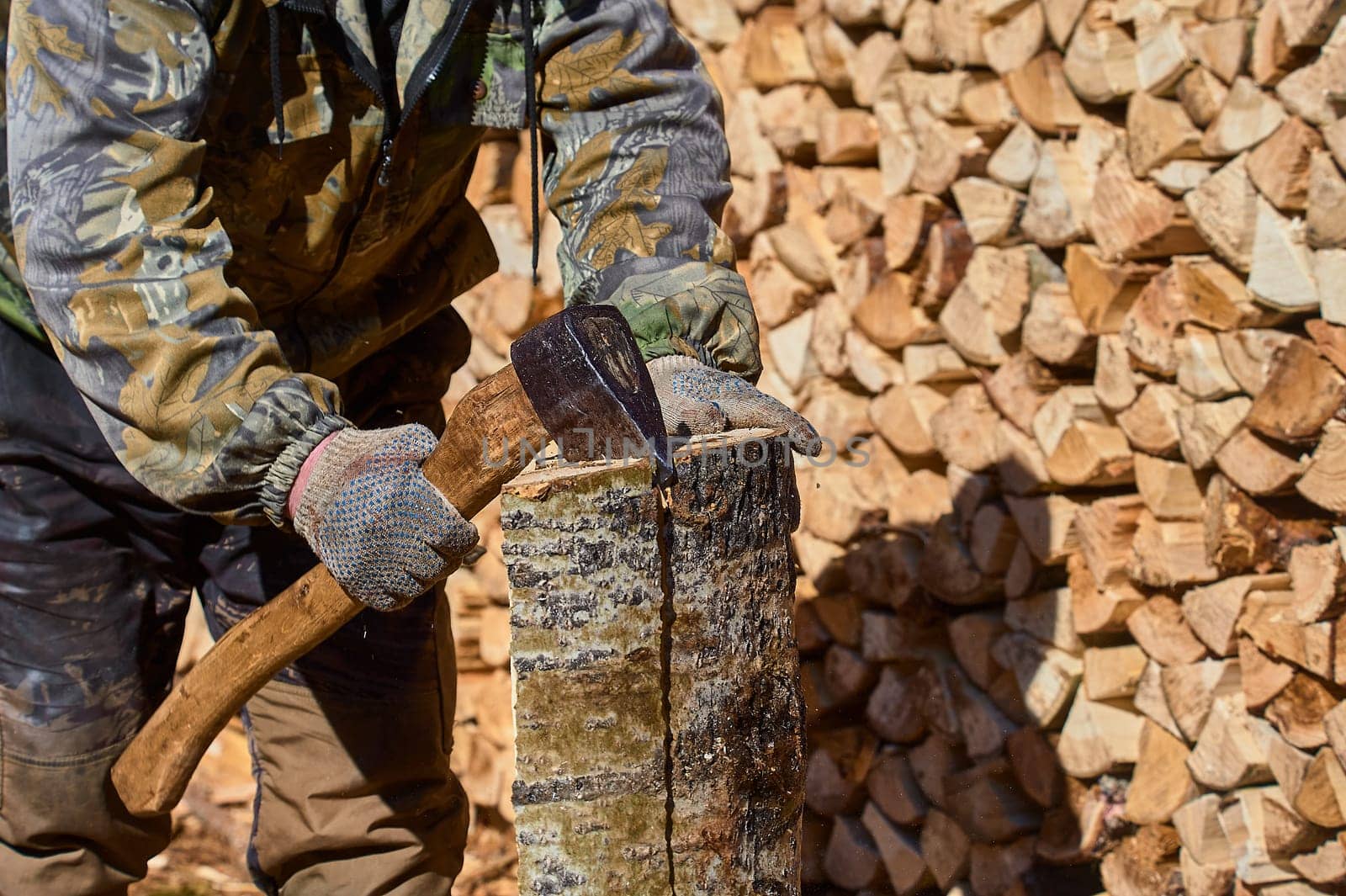 chopping firewood with a chopper close-up on a sunny day. High quality photo