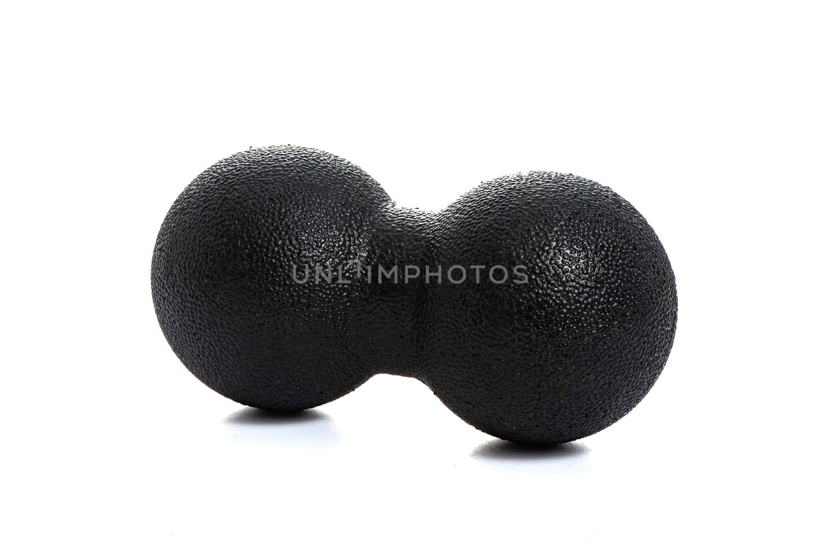 black double massage ball close-up for yoga on white isolated background. High quality photo