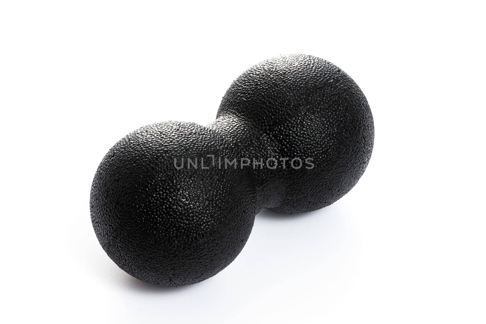 black double massage ball close-up for yoga on white isolated background. High quality photo