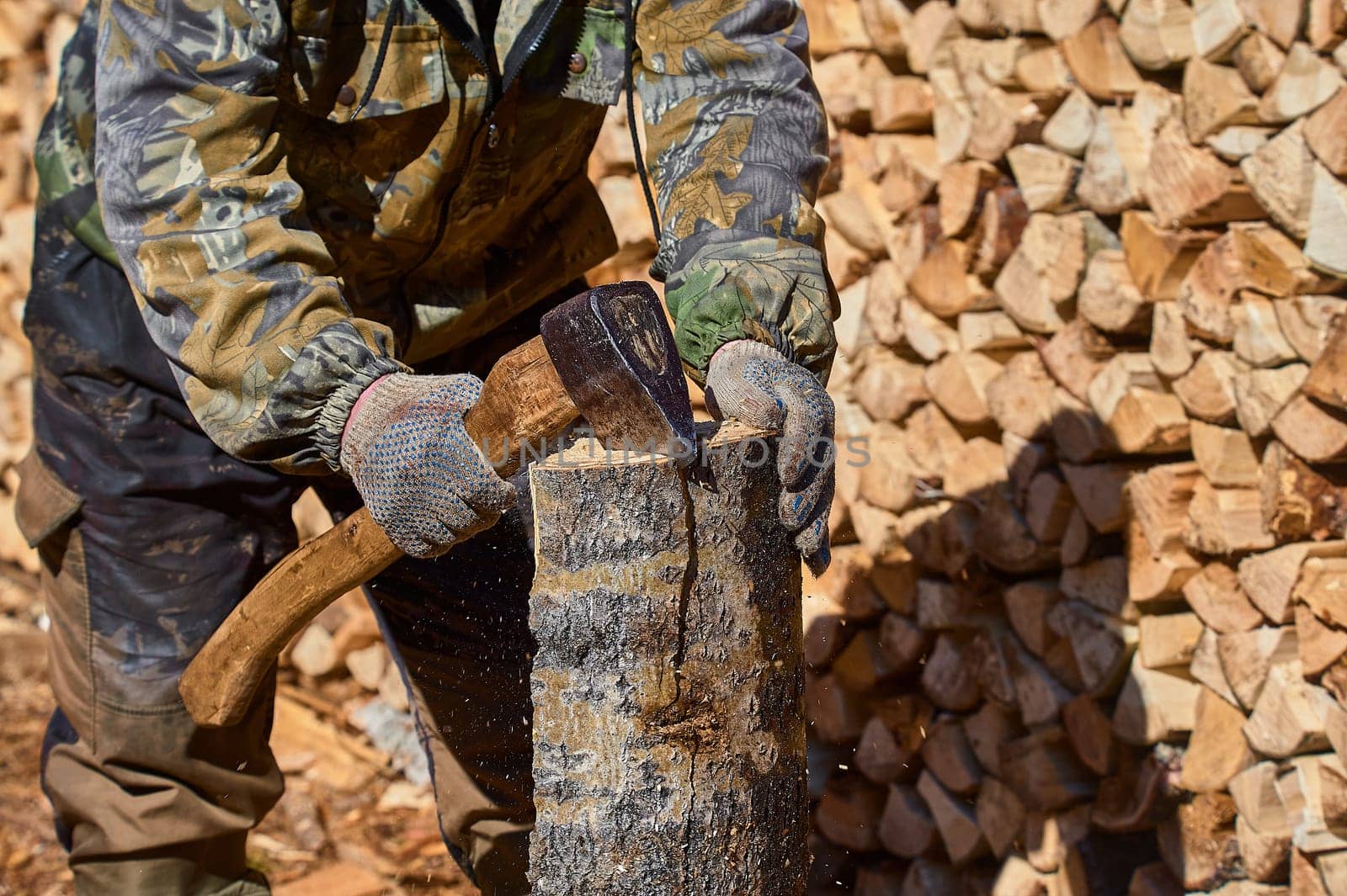 chopping firewood with a chopper close-up on a sunny day. High quality photo