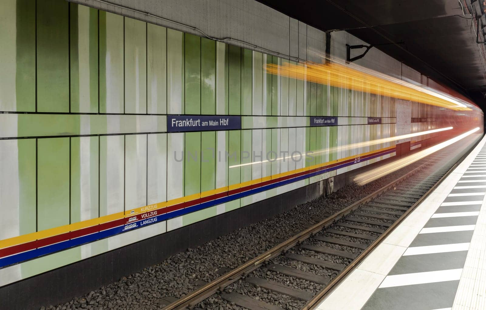 Frankfurt, Germany - March 3, 2019: blurred motion of metro train entering the train station in Frankfurt