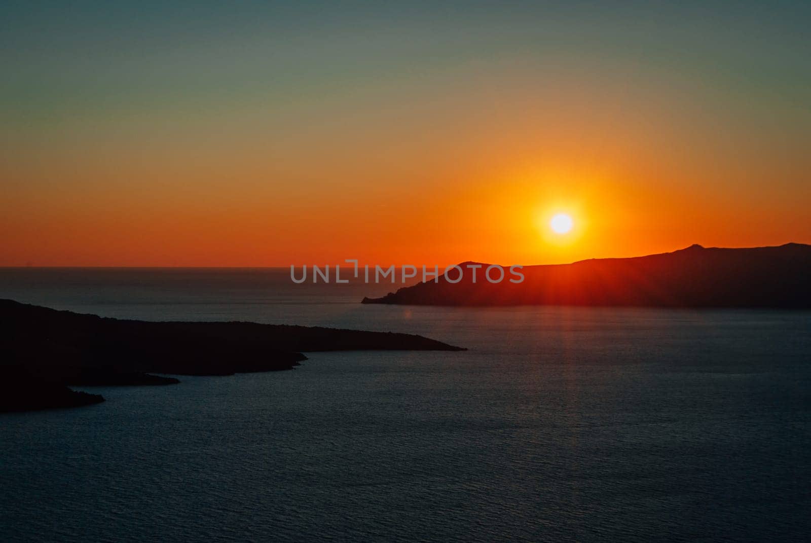Sunset over the caldera on the island of Santorini, Greece.