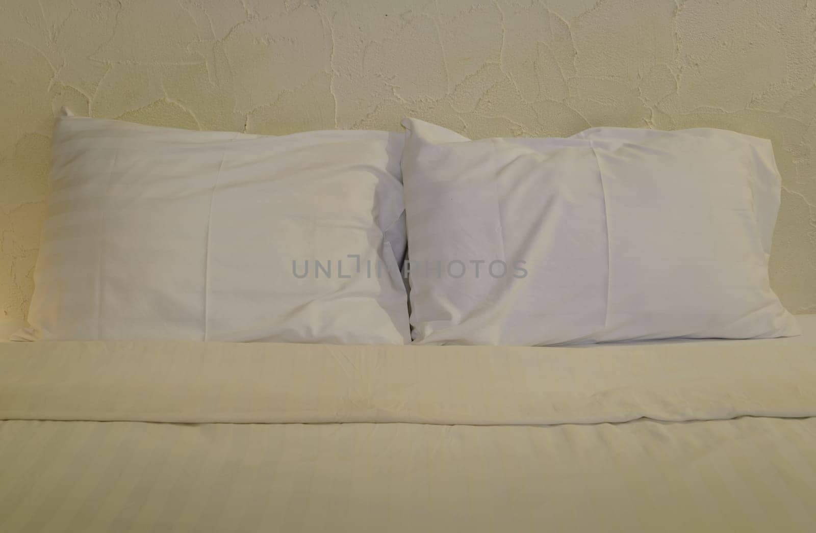 White pillows on bed