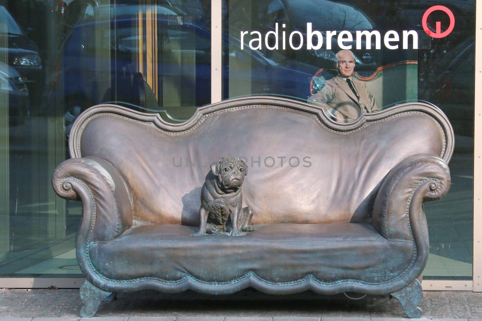 The Loriot (Vicco von Buehlow) bronze sofa with pug in front of the radio house of Radio Bremen in die Diepenau in Bremen,24.04.2015