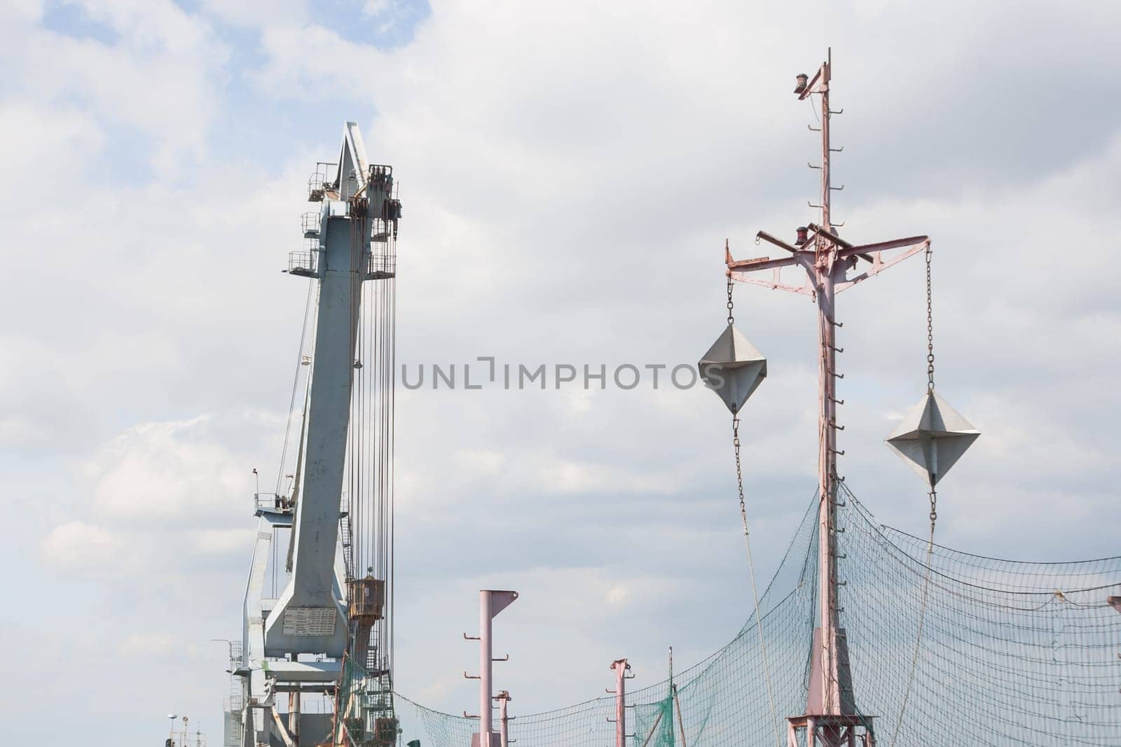 Targets for warship, with crane in background.