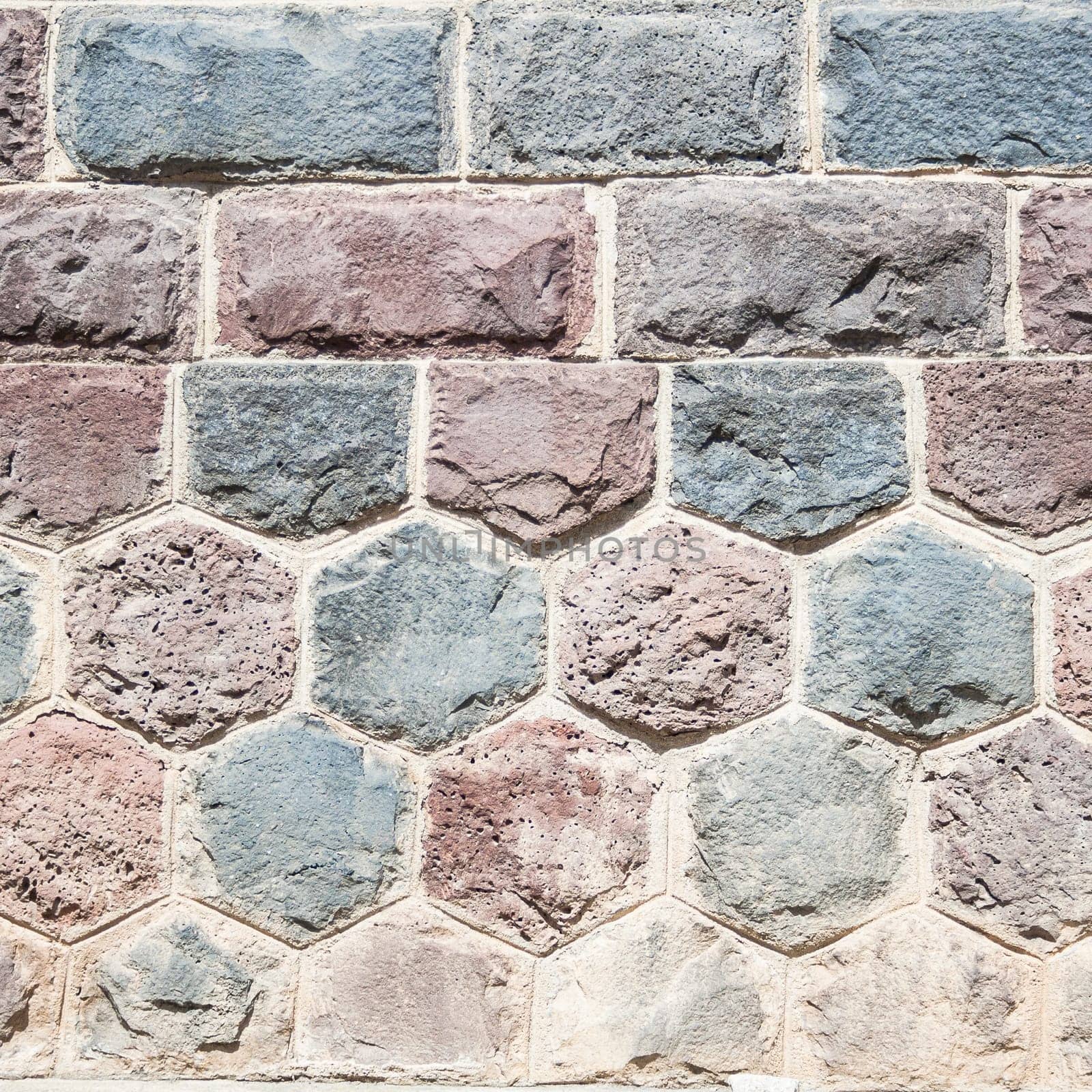 Basalt blocks lined. Close up of a wall of stone.