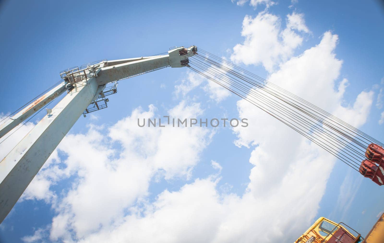 Ropes in an old crane. Orange lines .