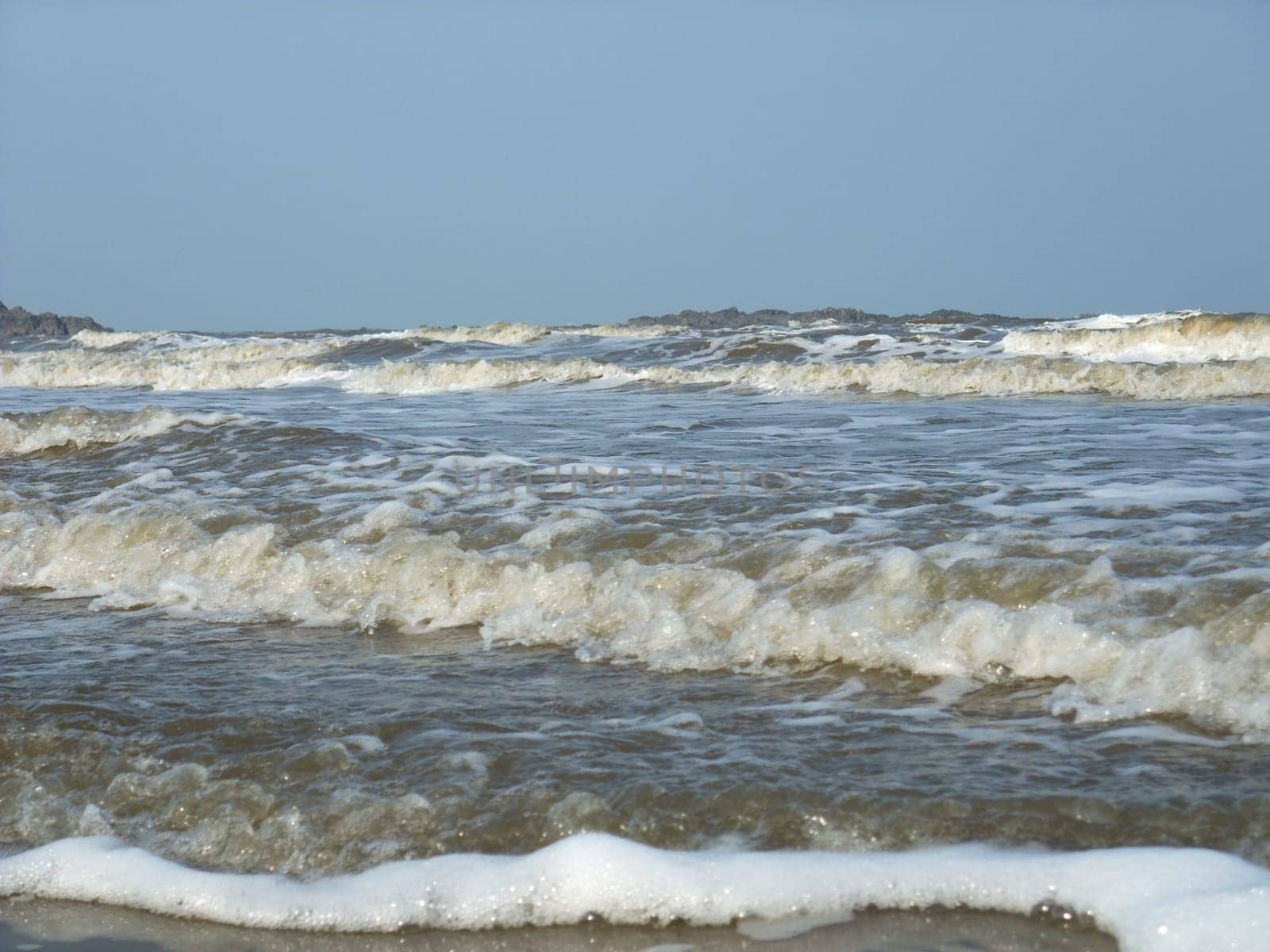 Foam made by the wave on the beach