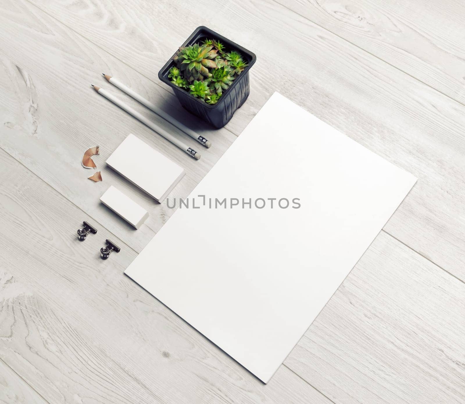 Blank stationery set on light wooden background. Corporate identity template. Responsive design mockup.