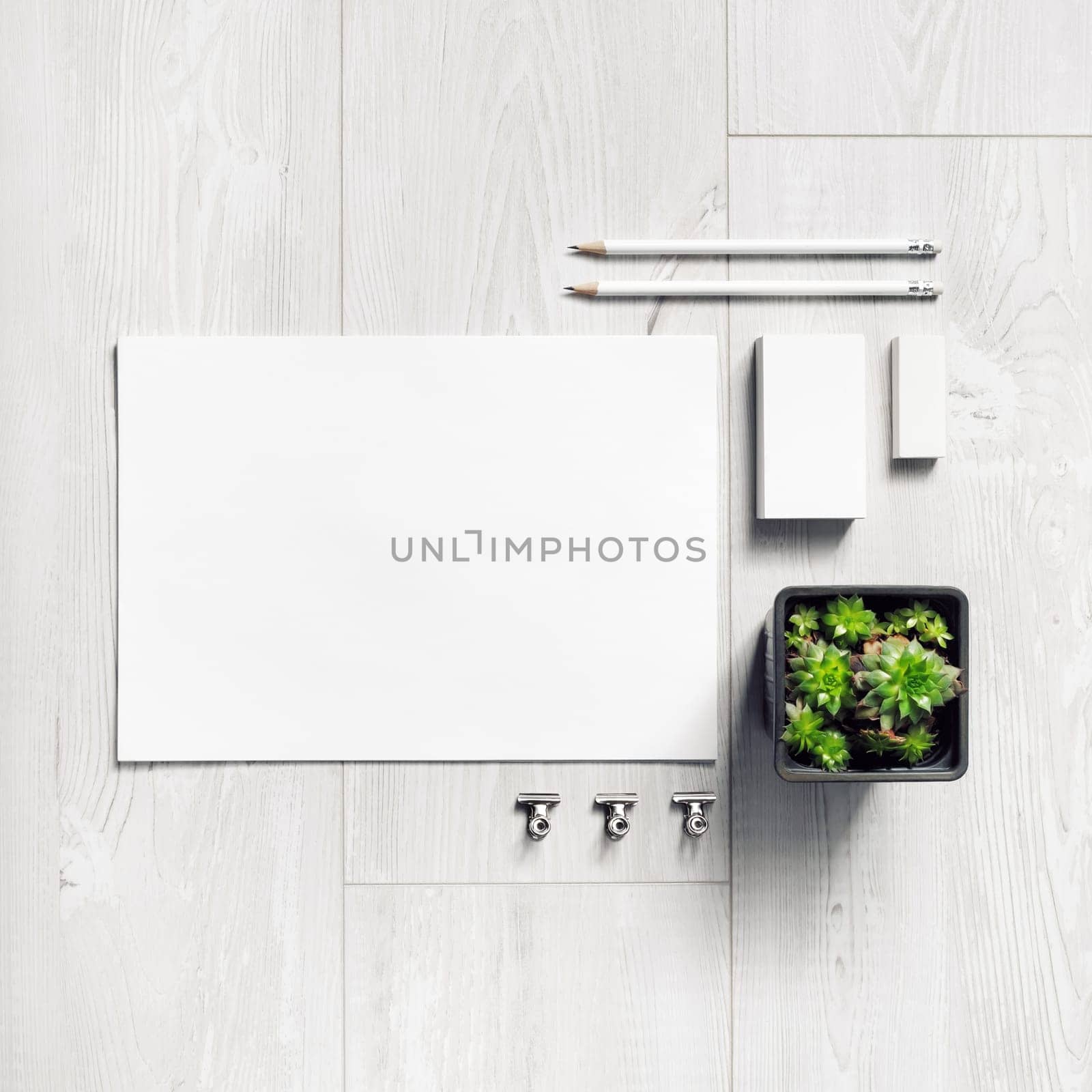 Photo of blank stationery set on black paper background. Corporate identity mockup. Responsive design template. Top view. Flat lay.