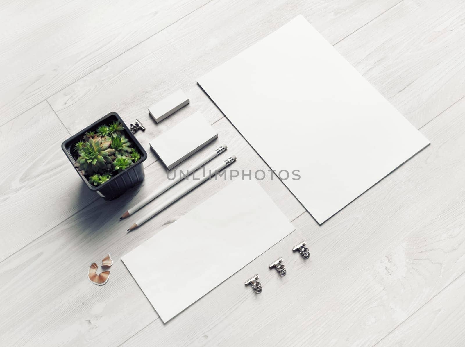 Blank stationery set on light wooden background. Template for branding design.