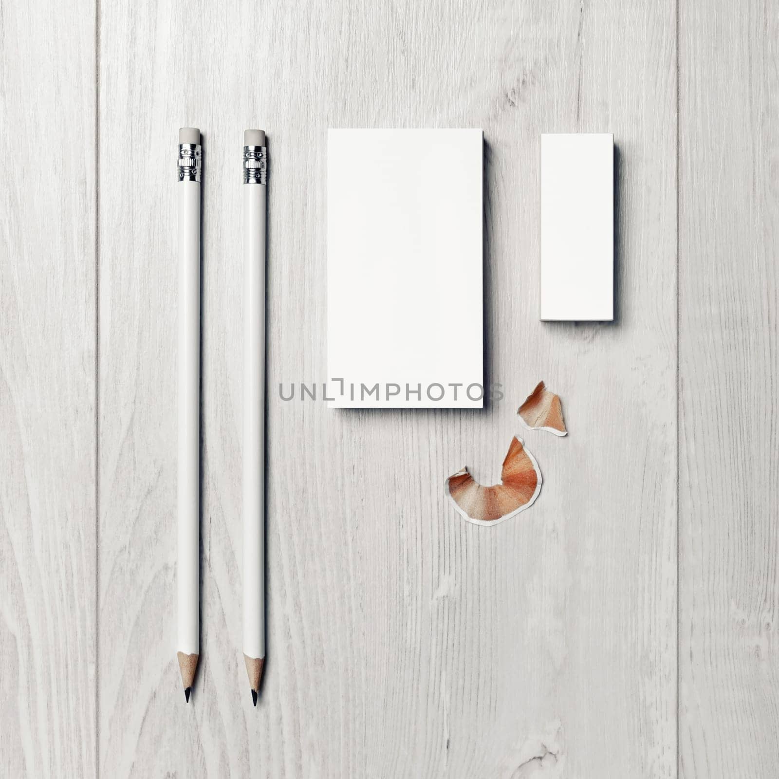 Photo of blank business card, pencils and eraser. Branding identity template. Top view. Flat lay.