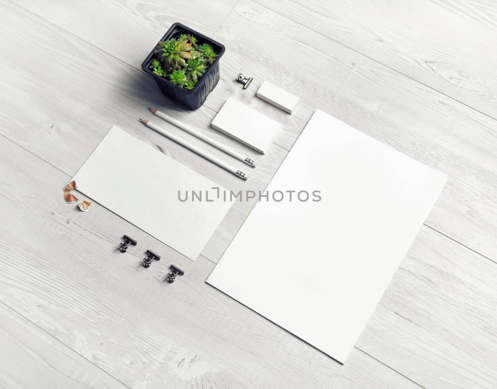 Stationery mock up. Blank corporate identity template on light wooden background. Responsive design mockup.