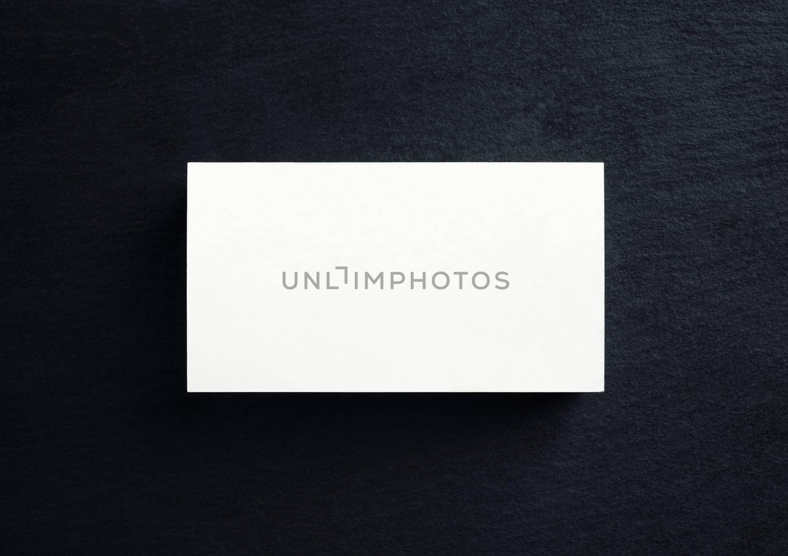 Blank white business card. Mock-up for branding identity. Top view. Flat lay.