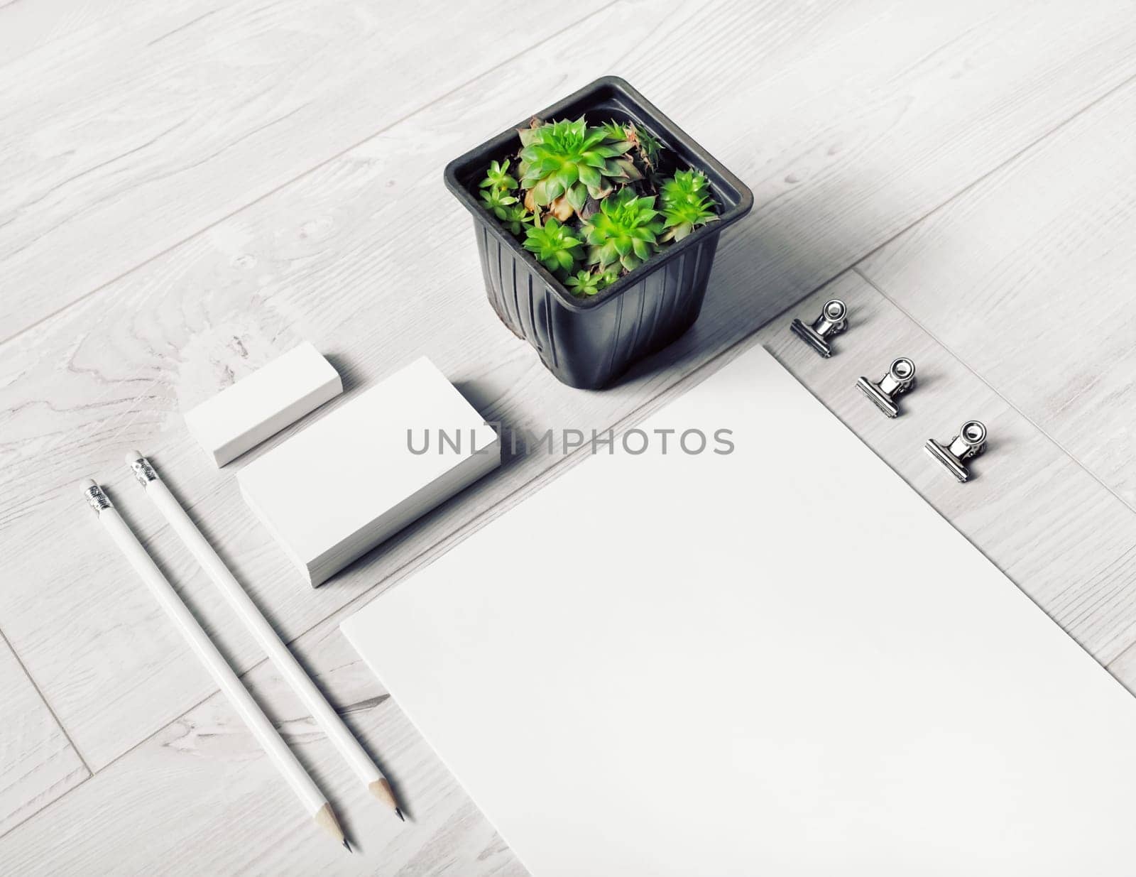 Blank corporate stationery set on light wooden background. Branding identity mock-up.