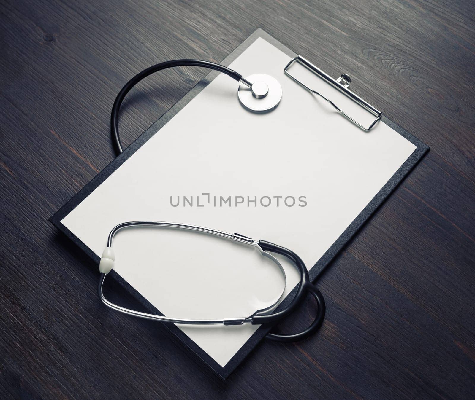 Health care concept. Blank medical clipboard and stethoscope.