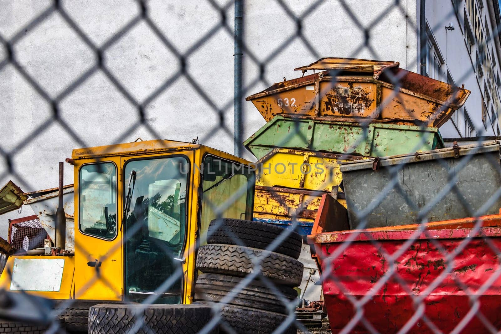 Areal with big old and rusty metal container for renting
