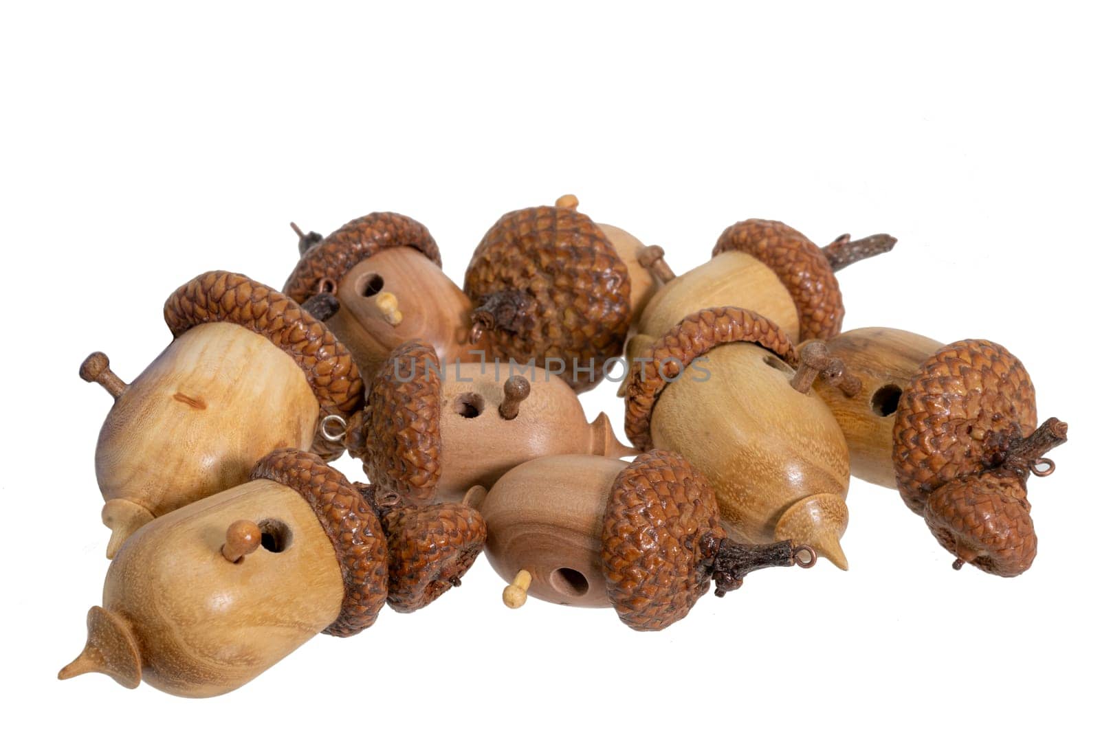 Collection of small turned birdhouses in a pile isolated on white