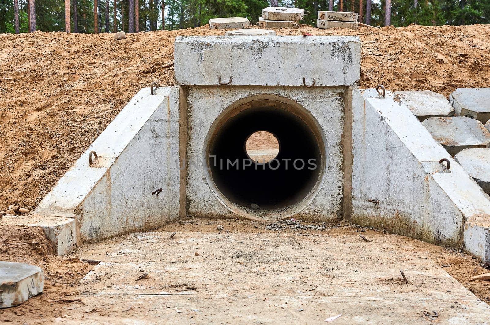 concrete pipe under the road for water drainage. High quality photo