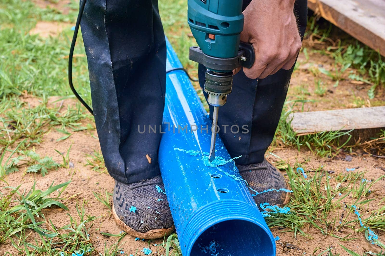 drill holes in a plastic pipe. High quality photo