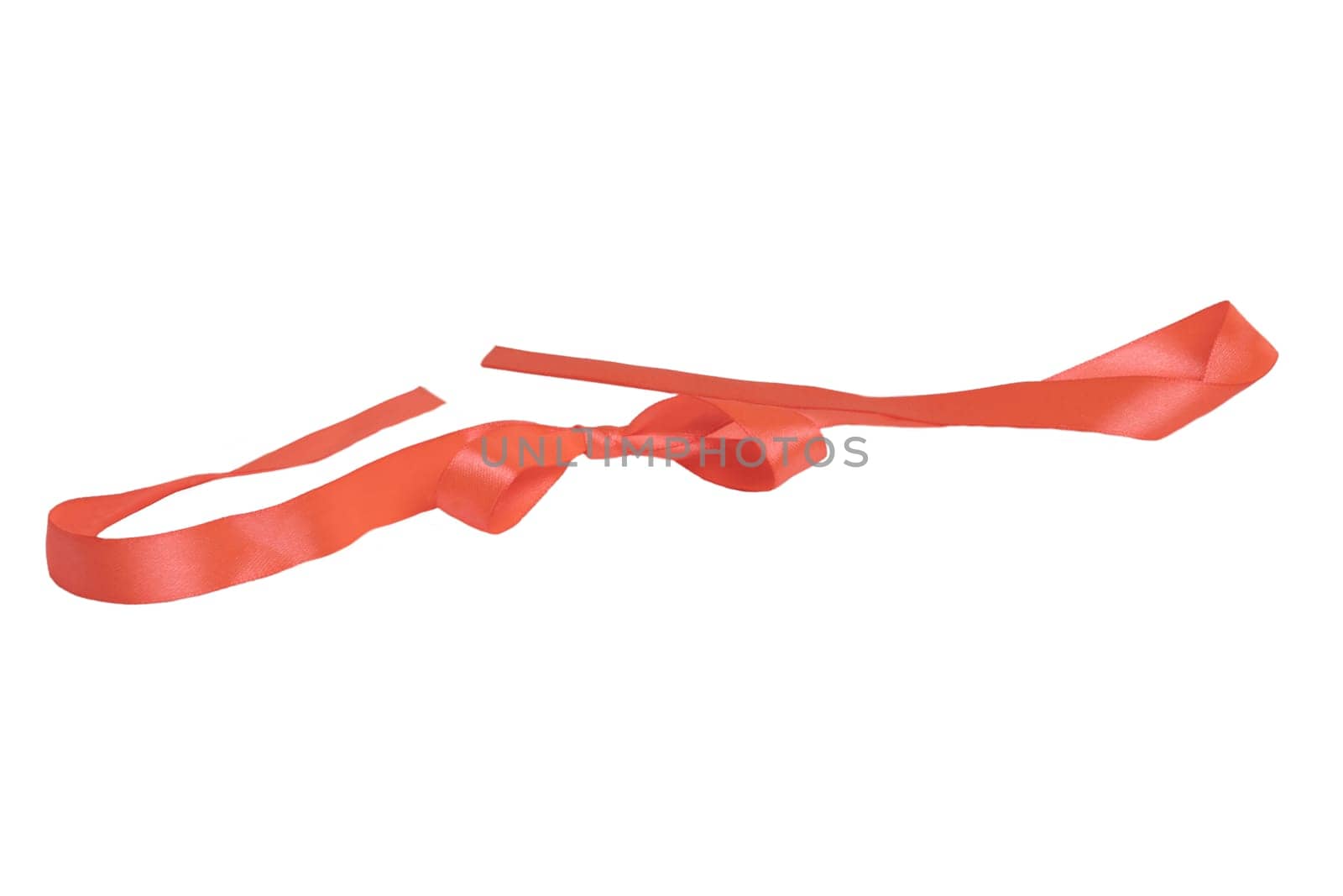 Gift bows. Closeup of a decorative red ribbon bow made of silk for gift box isolated on a white background. Decorations background. Macro photograph.