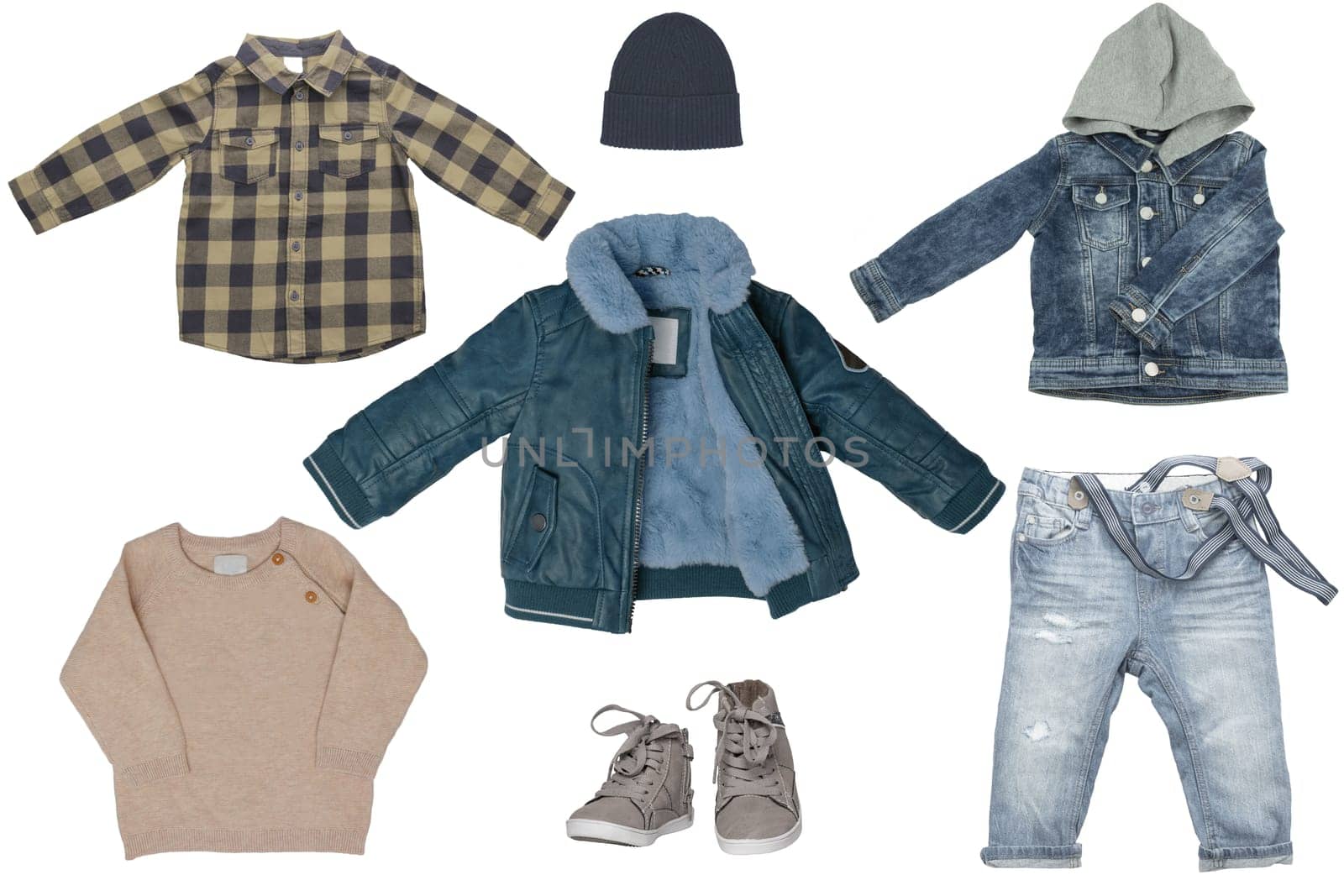 Collage set of little boy autumn clothing isolated on a white background. Denim trousers jeans, a pair sneaker, a leather jacket, a sweater and warm jacket with hood for child boy. Kids winter fashion.