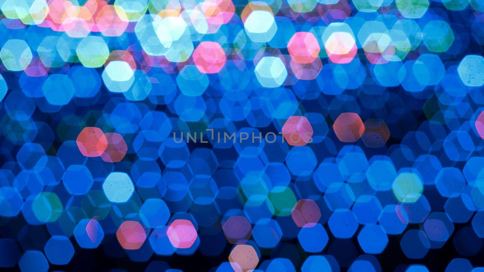Abstract colorful bokeh light on dark background. Christmas and New Year theme