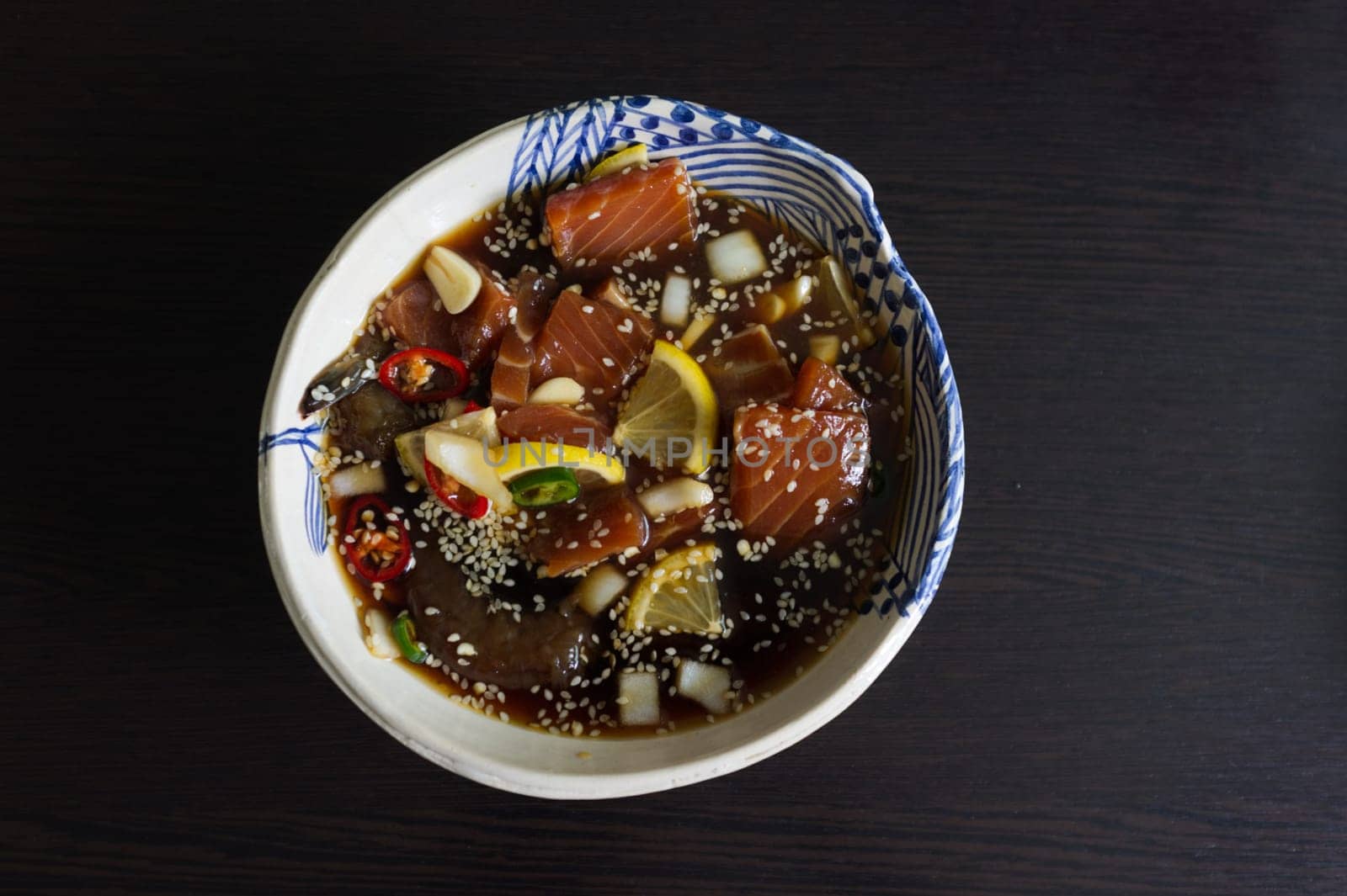 Salmon marinated shoyu or salmon pickled soy sauce in Korean style .