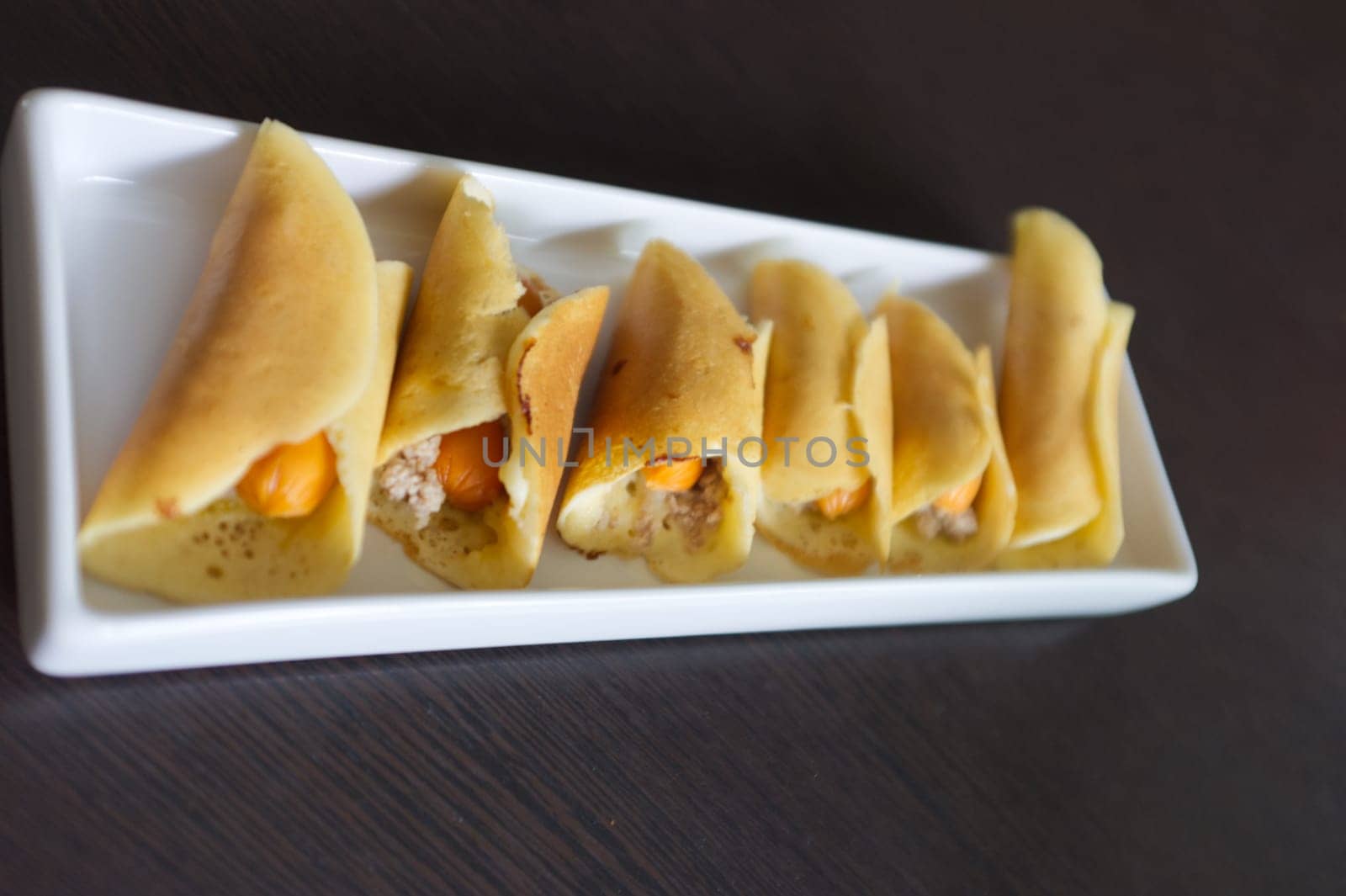Thai dessert (Khanom Tokyo), pancake roll stuffed with minced pork  and  sausage .