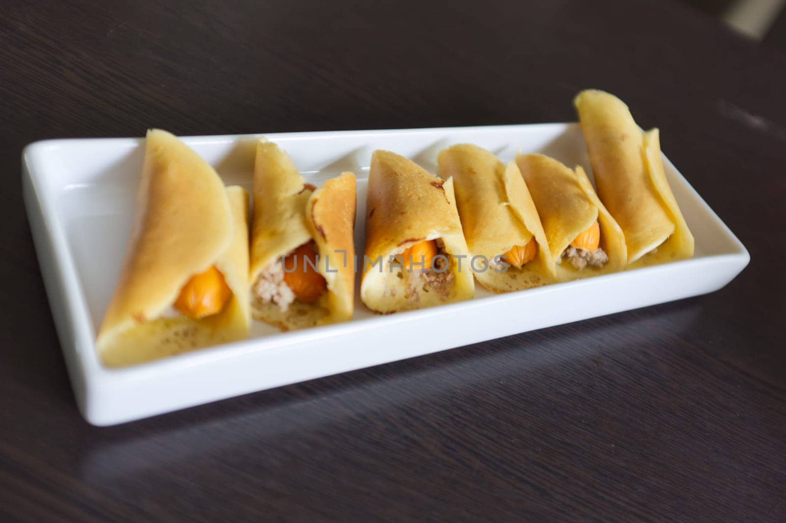 Thai dessert (Khanom Tokyo), pancake roll stuffed with minced pork  and  sausage .