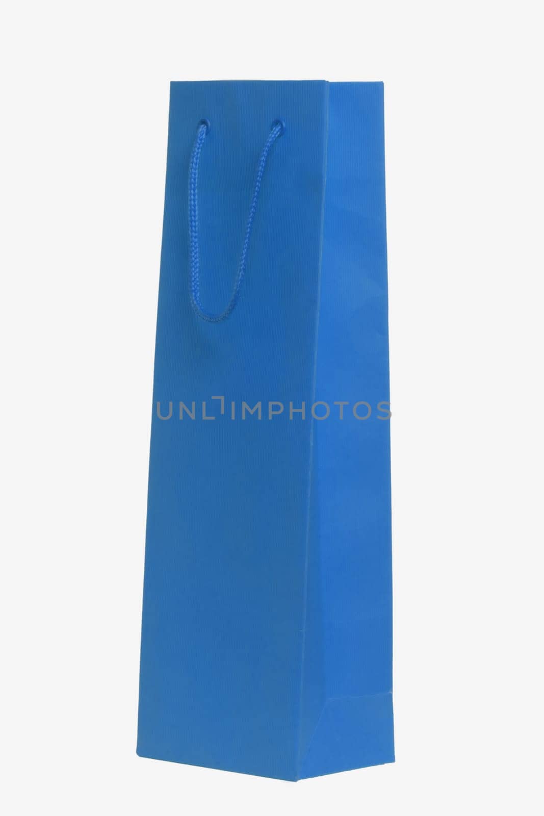 Closeup of a single blue paper bag or pouch with blue handle for shopping or for gifts isolated on a white background. Macro photograph.