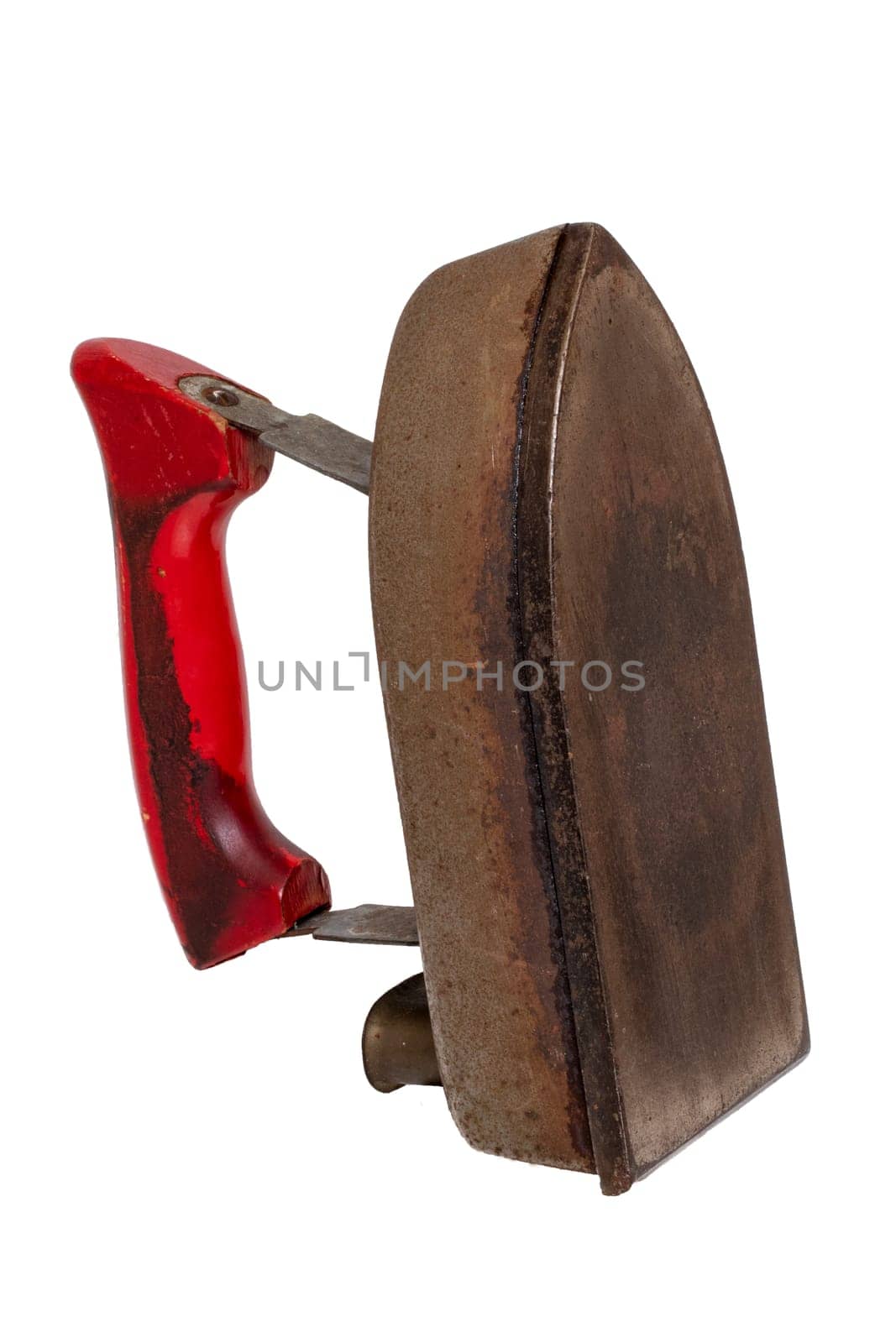 Old iron isolated. Close-up of a professional old rusty electric tailor iron with a red handle isolated on a white background. Tailoring accessories.