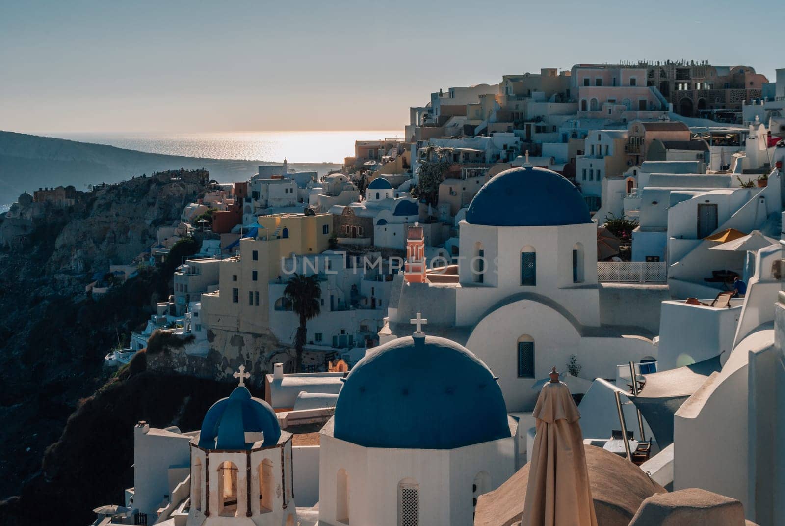 View of Mount Oia and the church with blue domes
