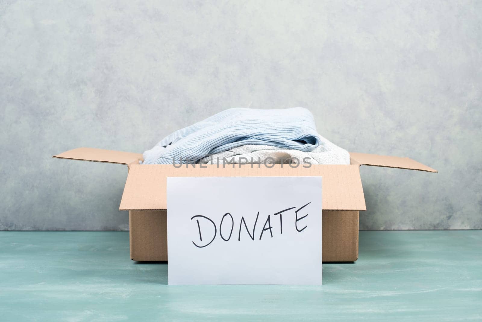 Package with used clothes for donation, second hand use for poor people, welfare