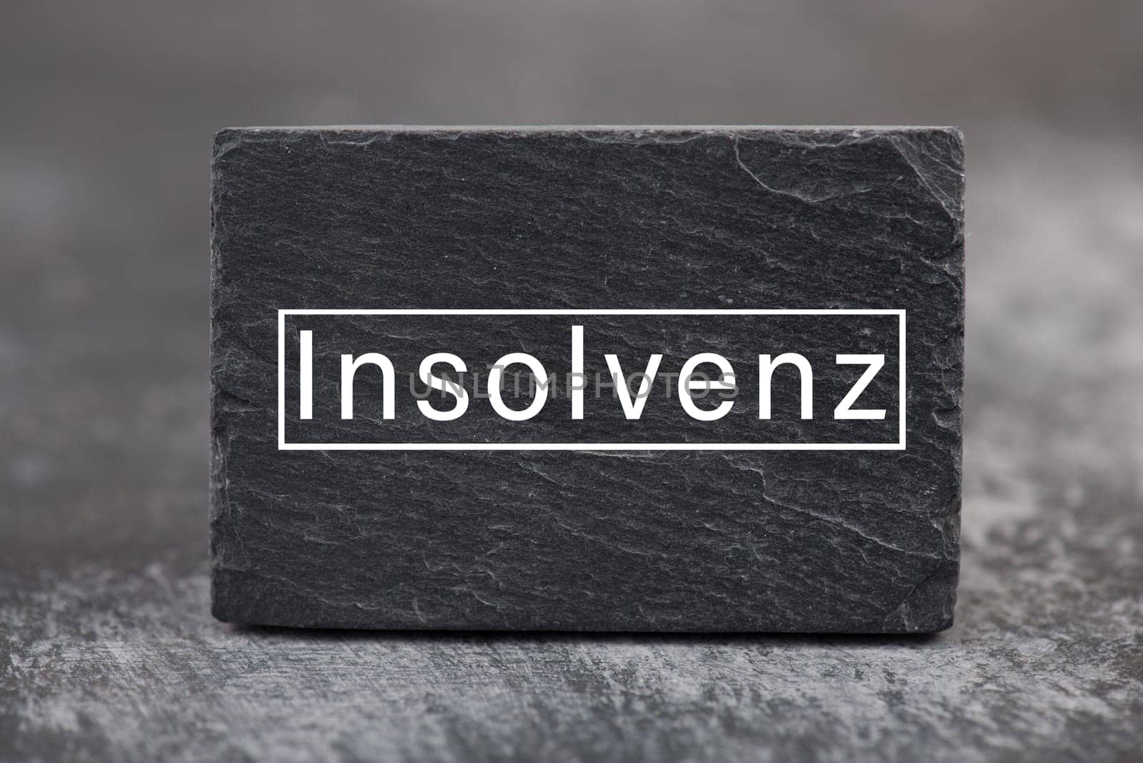 The word insolvency is standing in german language on a sign, bankrupt through lockdown, pandemic covid-19