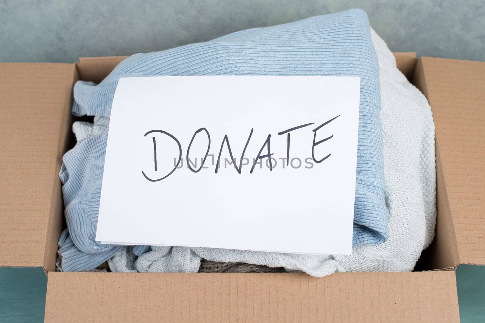 Package with used clothes for donation, second hand use for poor people, welfare