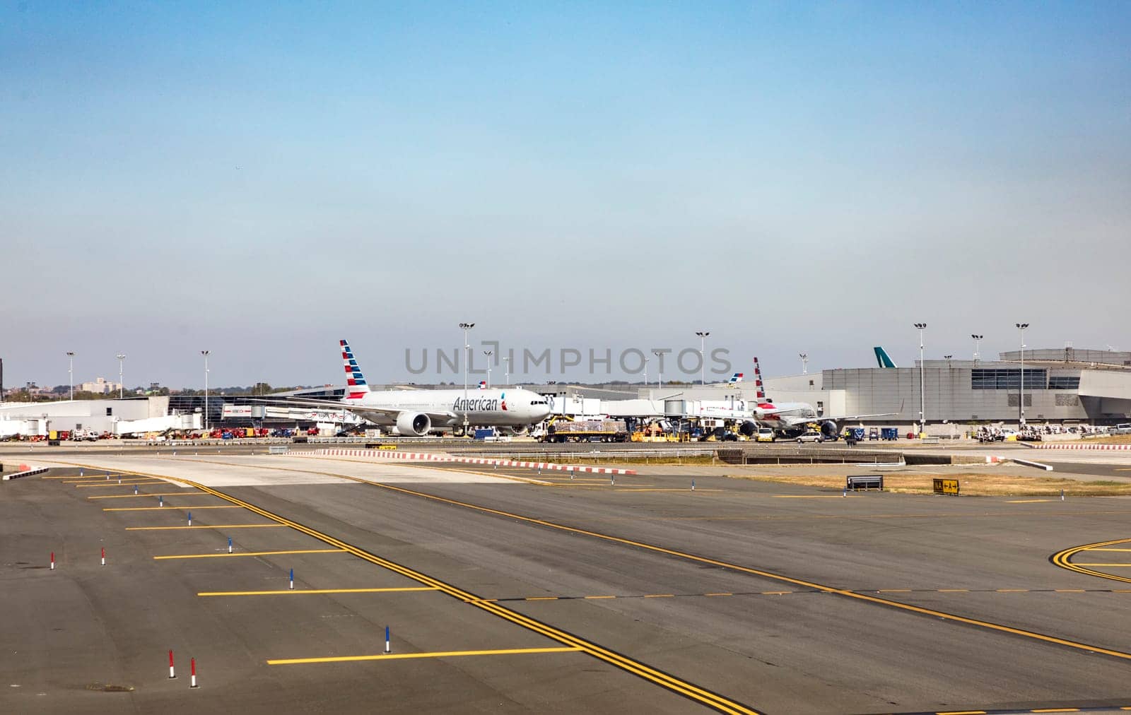 NEW YORK, USA  OCT 4, 2017: aircrafts at runway and apron of JFK Airport in New York. JFK airport is the biggest in New York and houses most international airlines.
