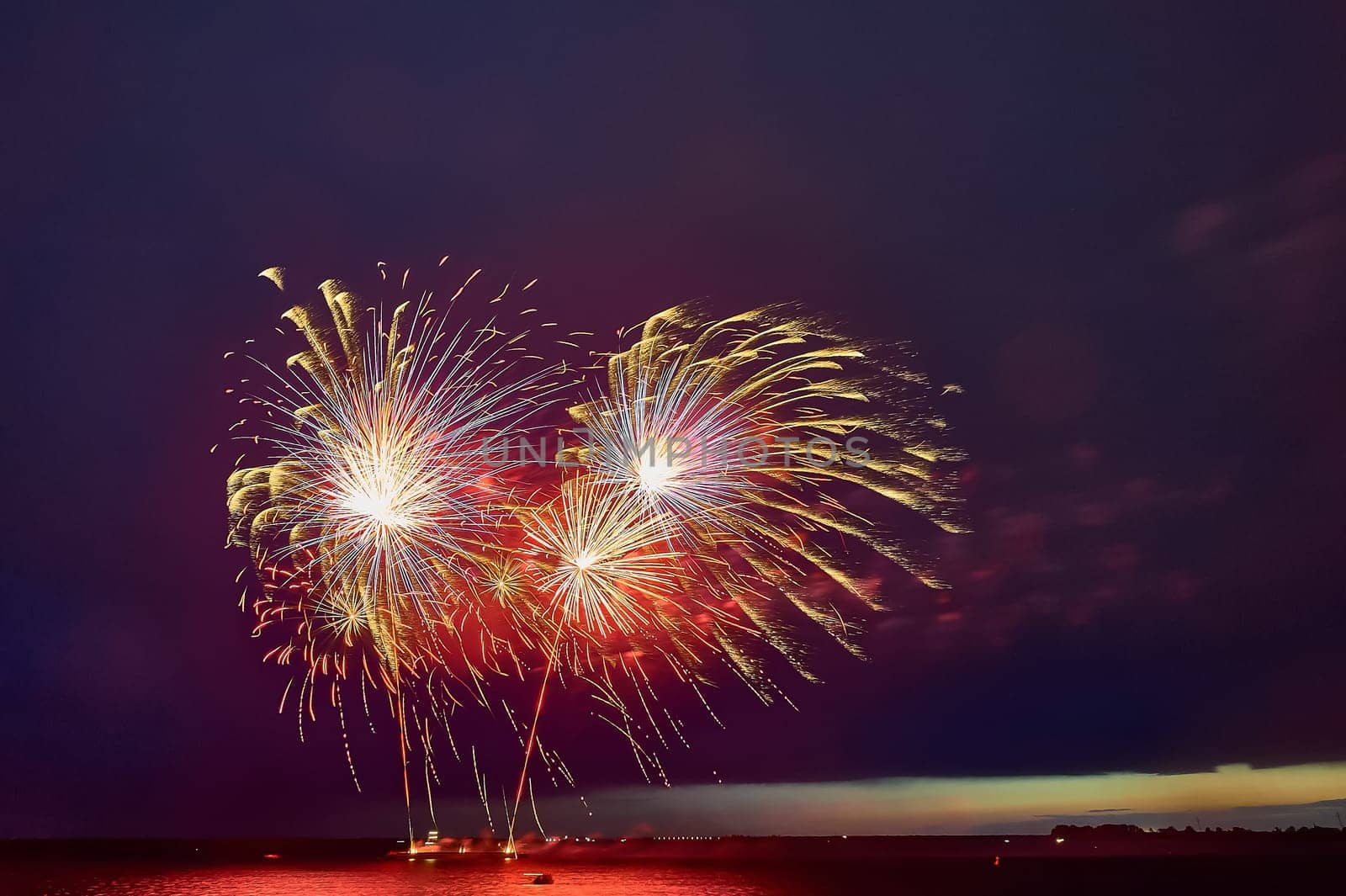 Colorful fireworks on the black sky background. High quality photo