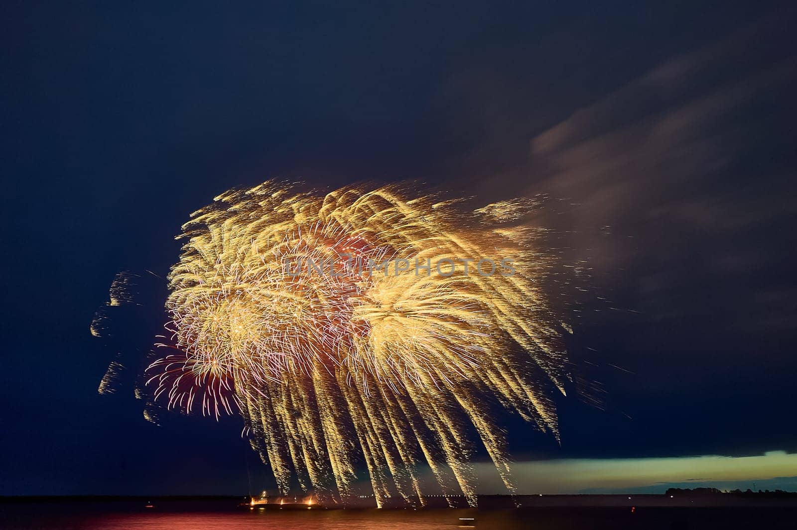 Colorful fireworks on the black sky background. High quality photo