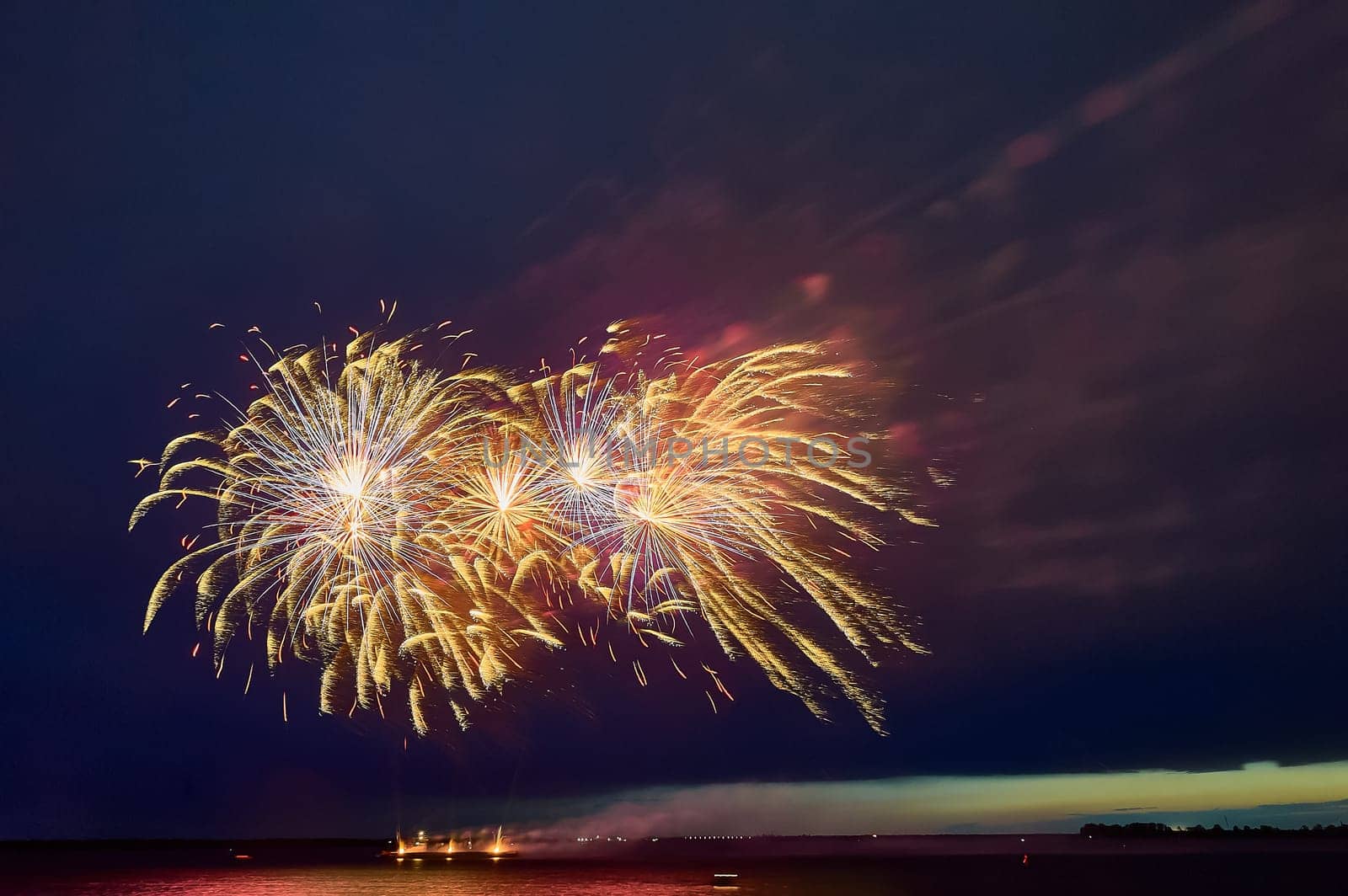 Colorful fireworks on the black sky background. High quality photo
