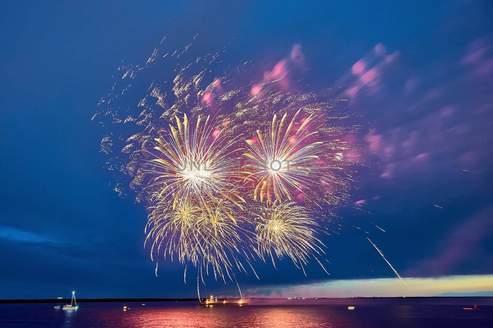 Colorful fireworks on the black sky background. High quality photo