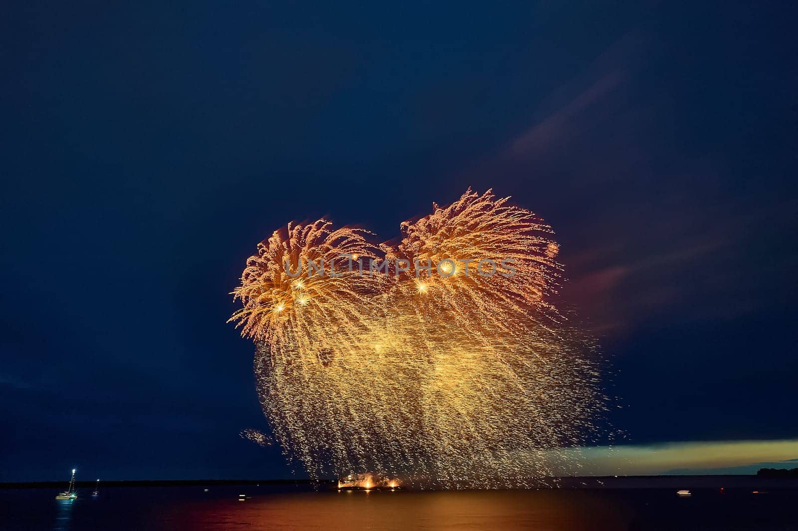 Colorful fireworks on the black sky background. High quality photo