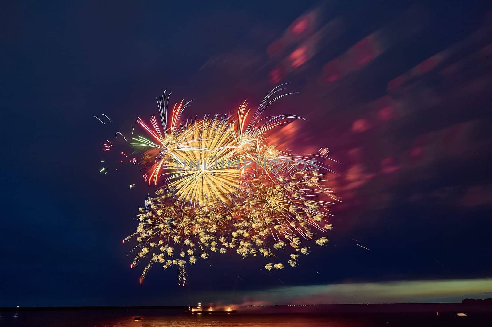 Colorful fireworks on the black sky background. High quality photo